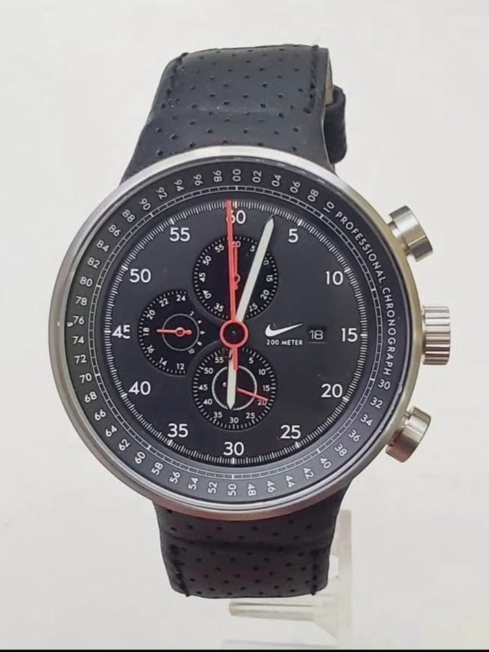 Nike Black Chronograph Watch with Red Accents and Silver Case